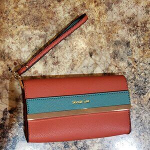 Wristlet Nicole Lee leather wristlet.